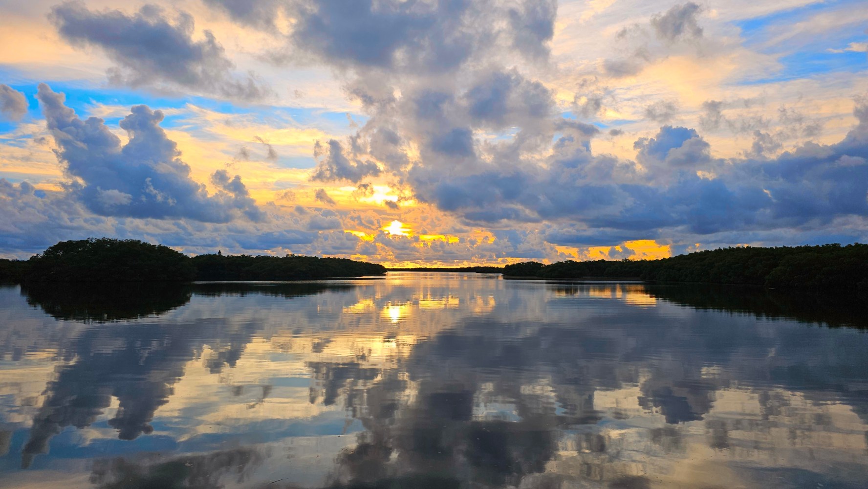 clouds in the sky over a body of water