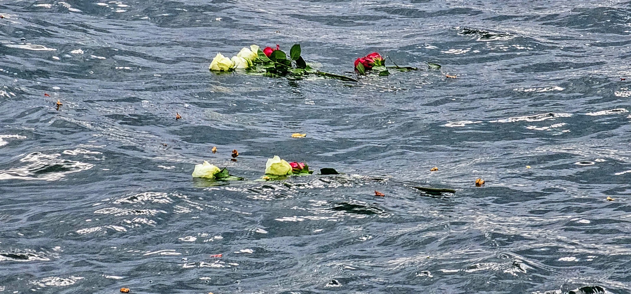 a group of people on a boat in the water